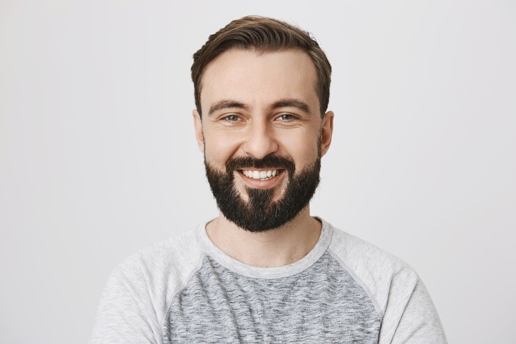 close-up-happy-laughing-bearded-man-smiling_176420-18793